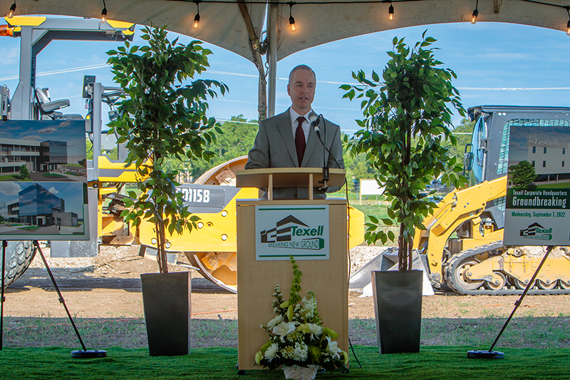 IMAGE: Tony Hale speaking at podium at HQ groundbreaking ceremony