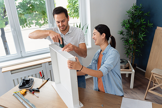IMAGE: Couple building drawers for a kitchen remodel