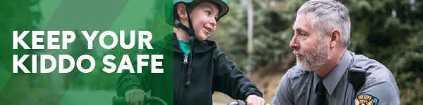 IMAGE: Boy on bike talking to an officer from the Sheriff's Dept. with text Keep Your Kiddo Safe