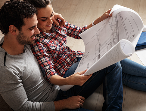 IMAGE: Couple looking at blueprints together