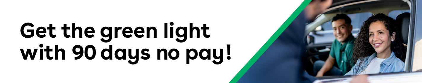 IMAGE: Couple sitting behind the wheel of a car with text Get the green light with 90 days no pay!