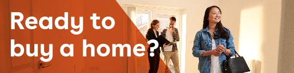 IMAGE: Woman smiling while realtor talks with her partner inside a new home with text Ready to buy a home?