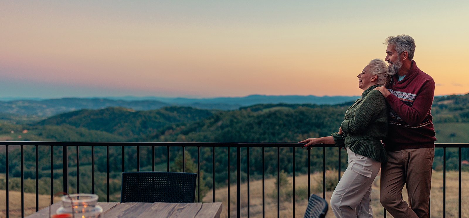 IMAGE: Older couple looking at sunset